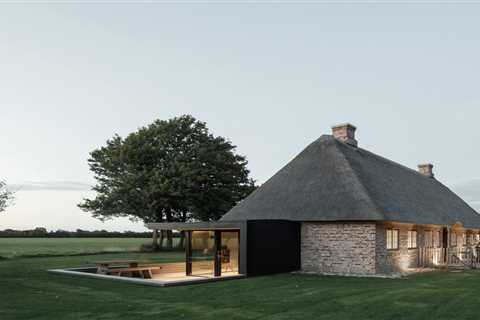 A Dilapidated 1800s Farmhouse Is Revived With a New Thatched Roof and a More Open Plan