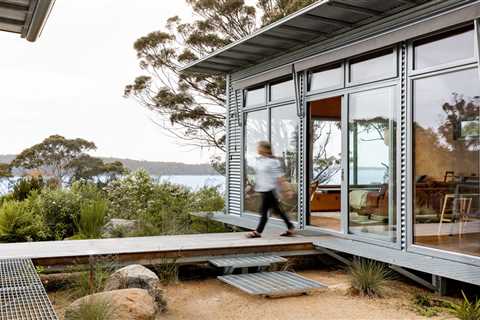 A Corrugated Steel Shell Gives Way to Warm Timber Interiors at This Cabin Retreat in Tasmania